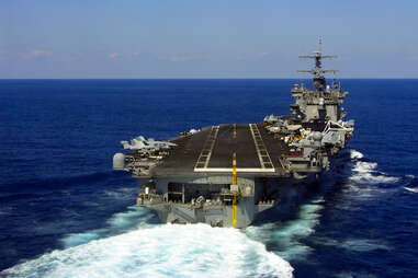 Plane landing on aircraft carrier