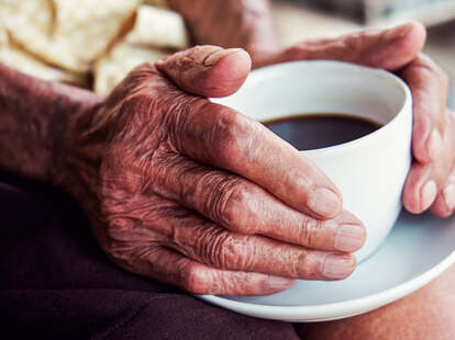 old hands and coffee