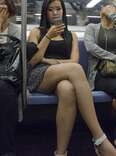 woman on phone on subway