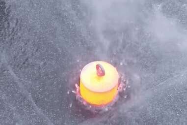 World's First Heated Ice Press Makes Crystal-clear Orbs in a