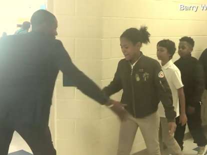 teacher has special handshakes for every student
