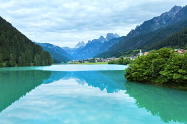 turquoise waters of lago blu, surrounded by mountains 