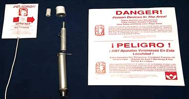 M44 device with danger sign