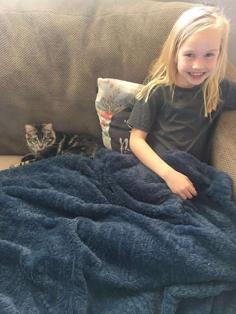 8-year-old Britta with her blind rescue cat, Lucky