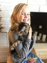 8-year-old Britta with her blind rescue cat, Lucky