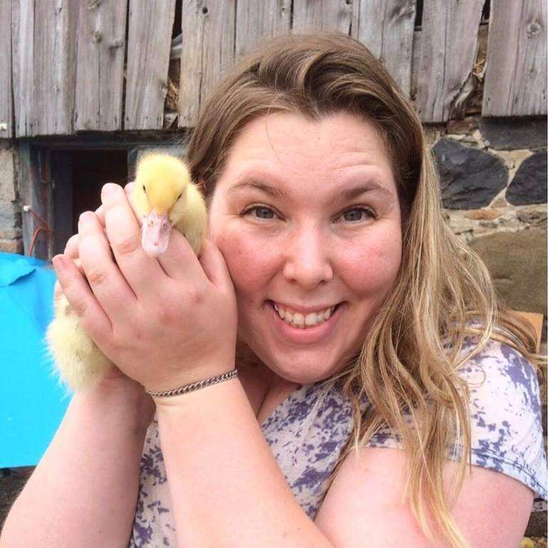 woman holding baby duck