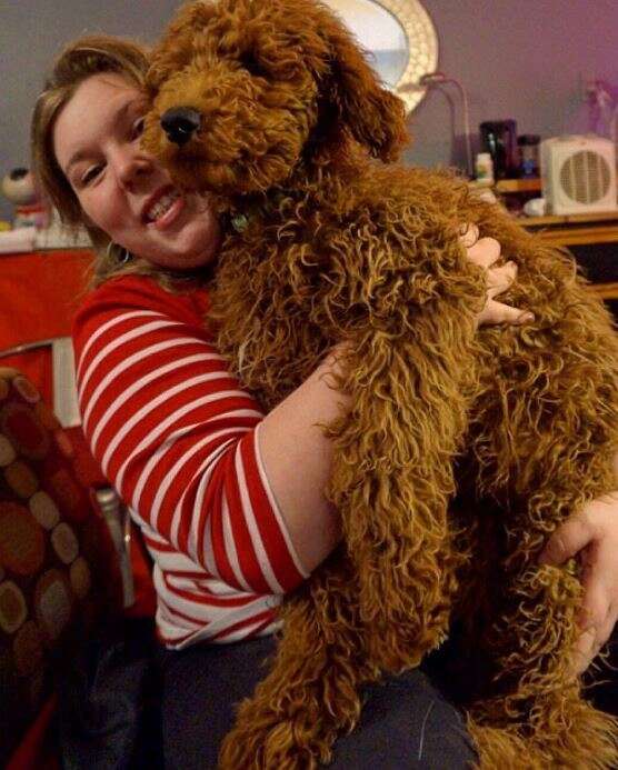 woman hugging service dog