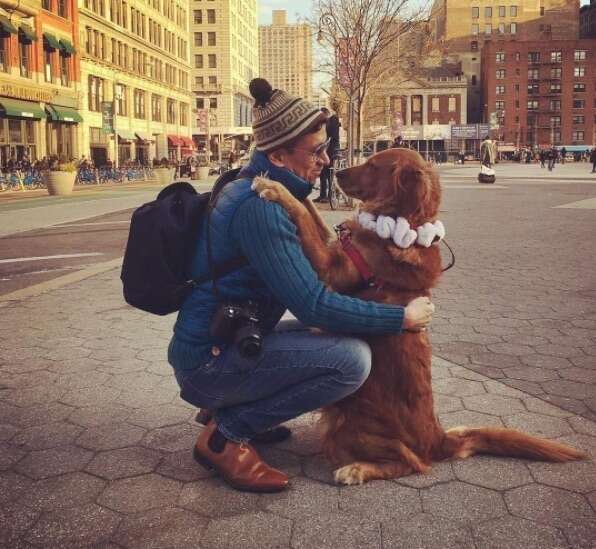 Loubie hugging her owner in NYC