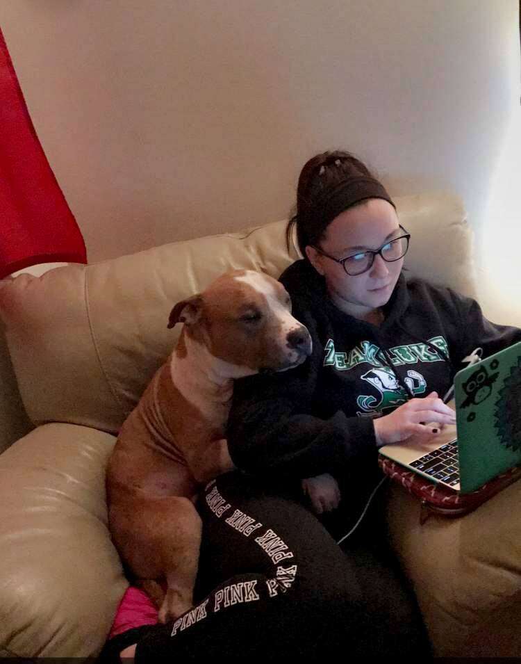 Russ the pit bull hugging his new mom, Kayla