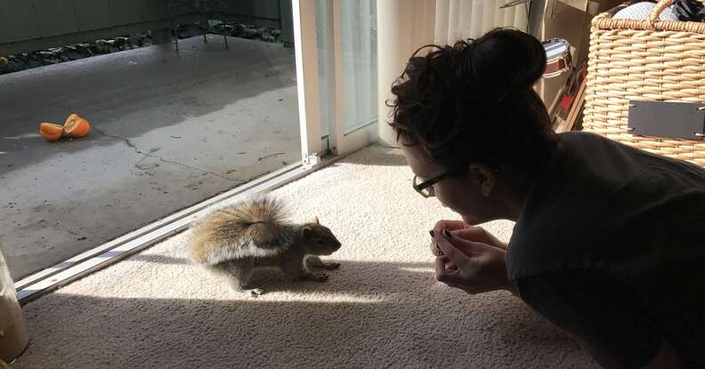 woman makes scenes for squirrels