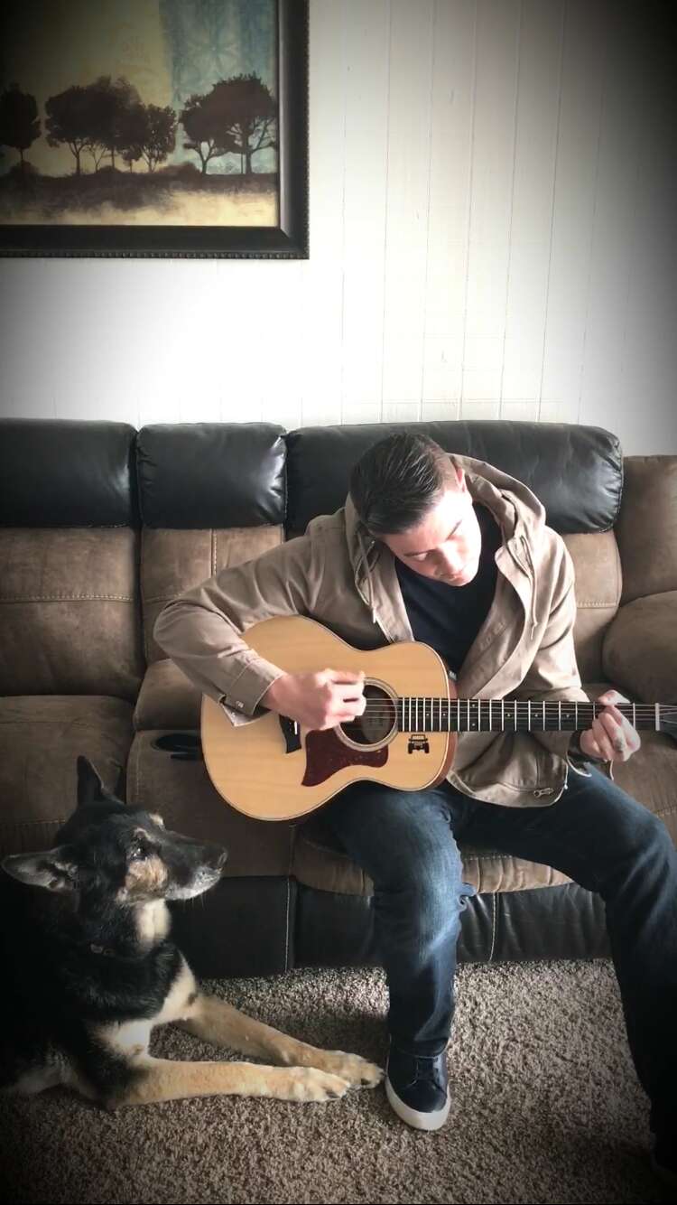 Bodza, a former bomb detector dog for the U.S. air force, and his owner, Kyle Smith.