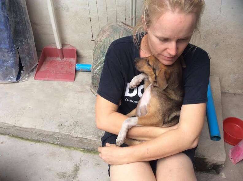 Woman with rescued puppy