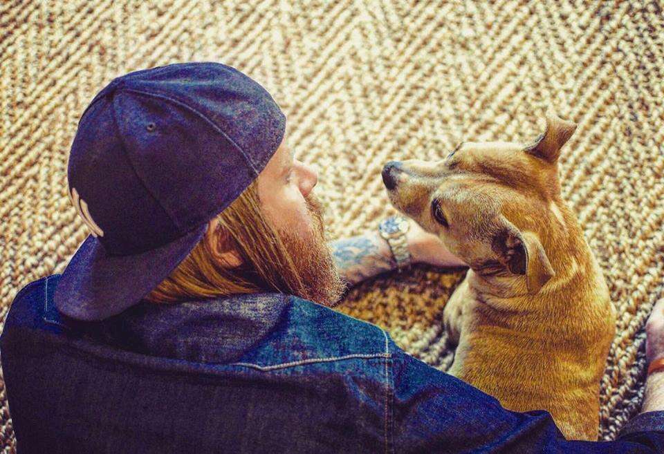 man hanging out with his dog