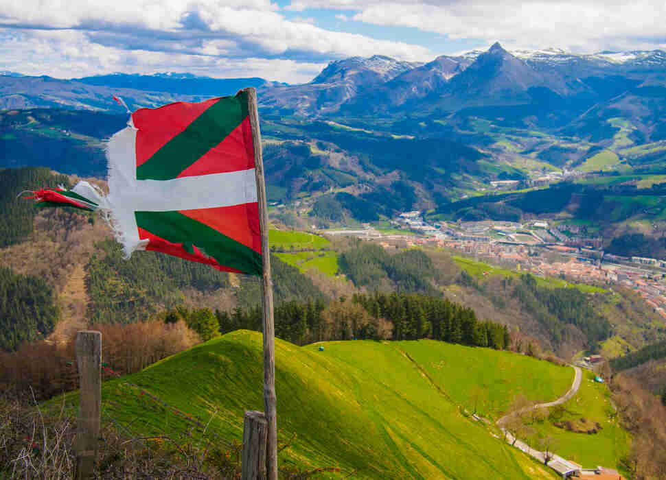 Basque Country Flag flying with Txindoki Mountain in the background