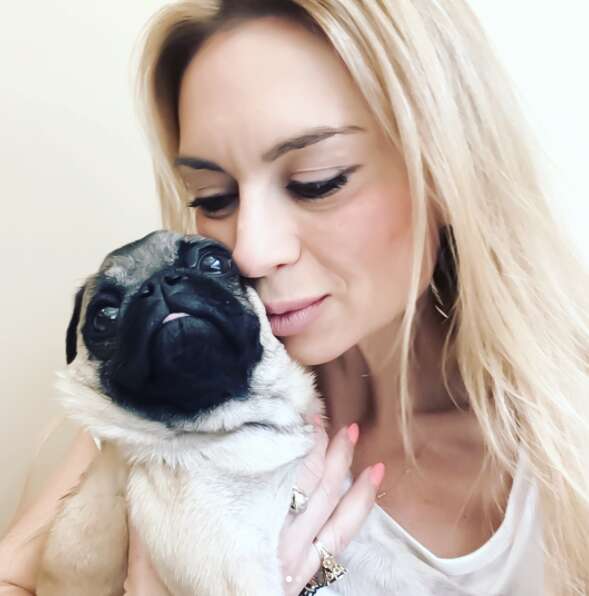 Woman with rescued pug