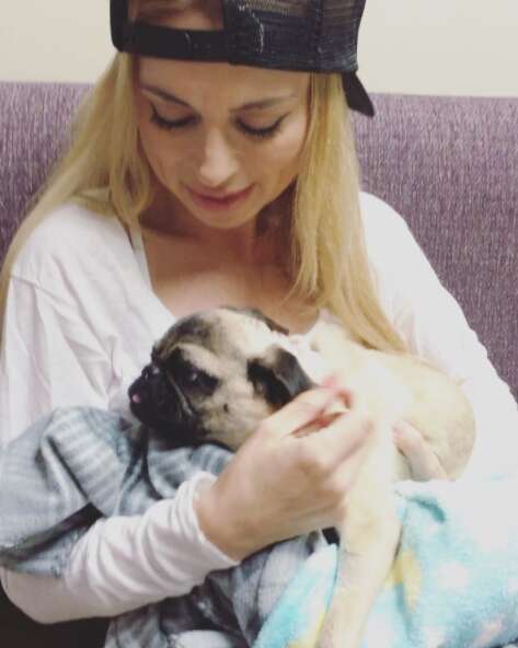 Woman with rescue pug from Iran