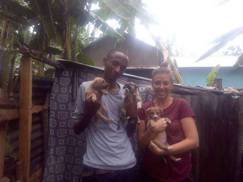 People holding rescue puppies