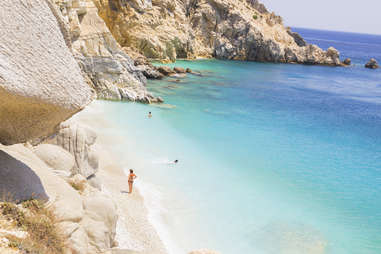 people enjoying the beach of ikari, greece