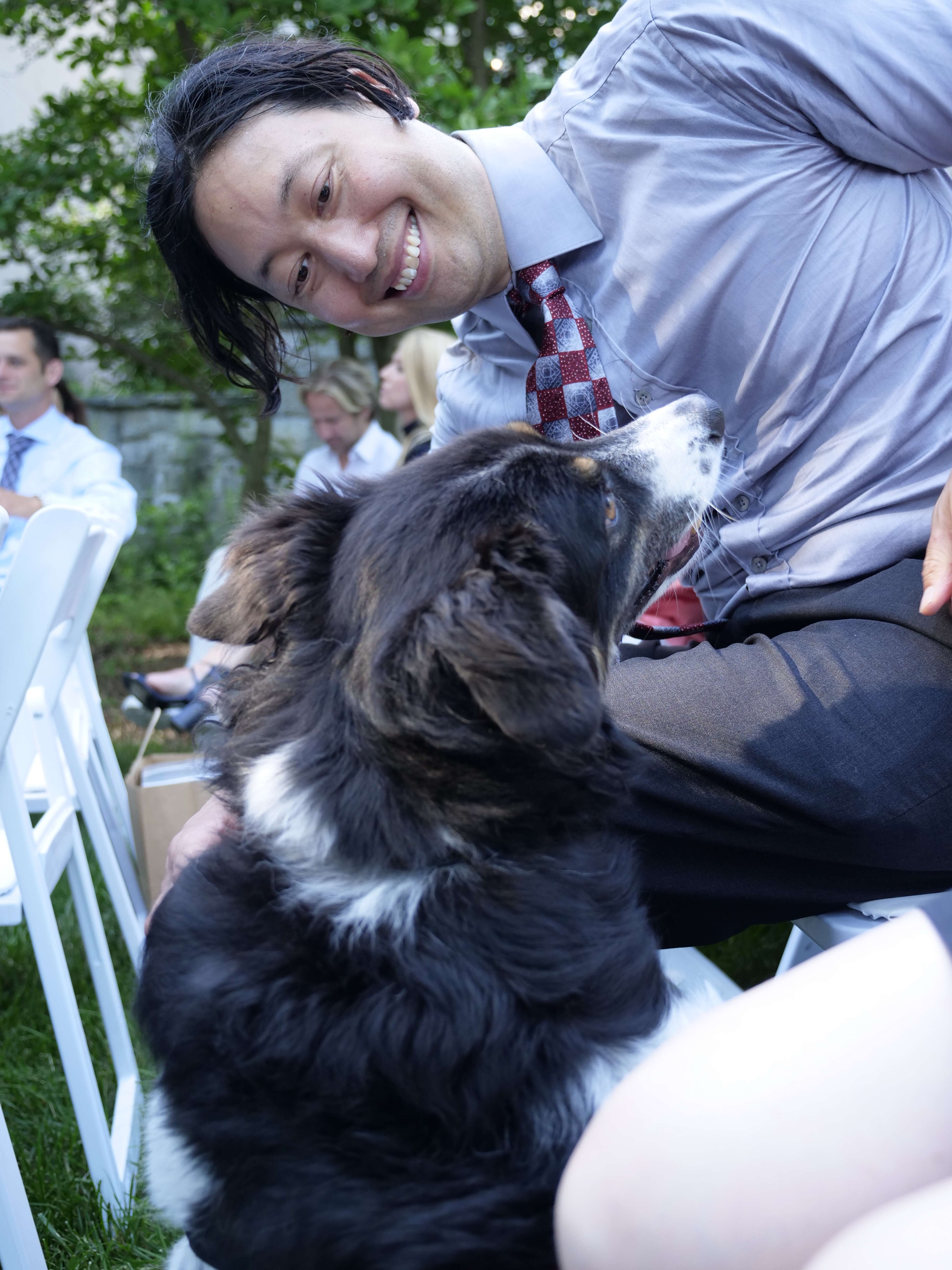 Man with dog at wedding