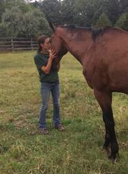 Woman hugging rescue horse