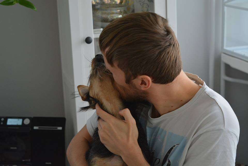 Man kissing rescue dog