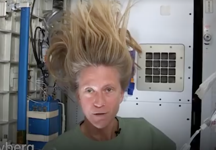 astronaut washing hair in space