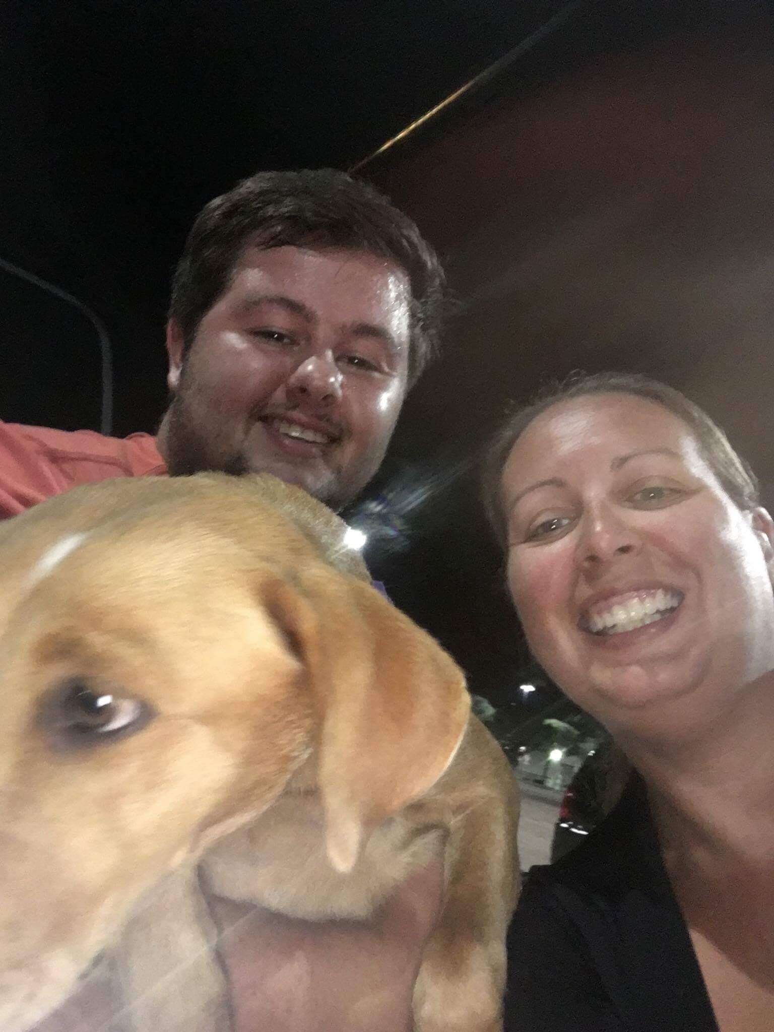 woman and man with rescue dog