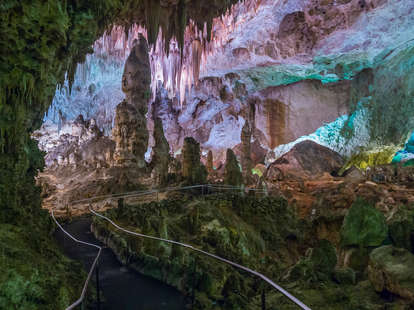a path leading through a well-lit cave