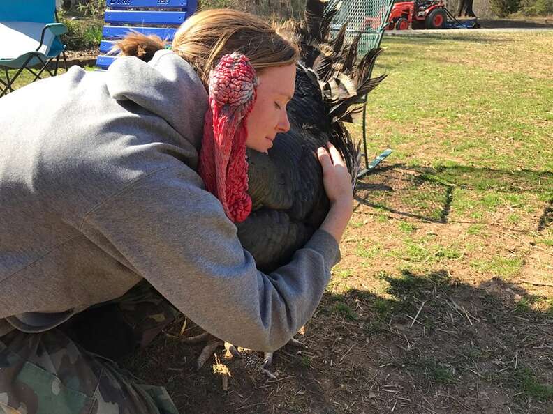 Woman hugging turkey