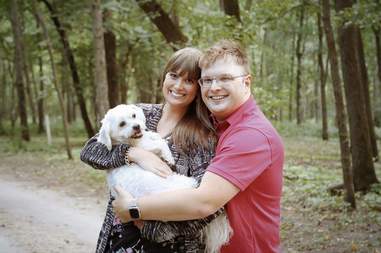 couple does baby photoshoot with dog