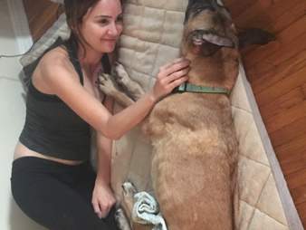 Woman cuddling rescue dog