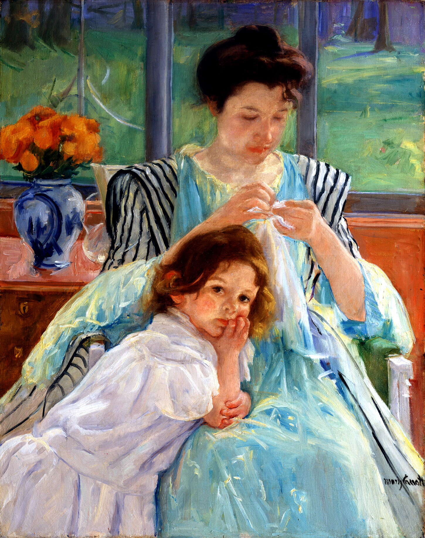 young mother sewing