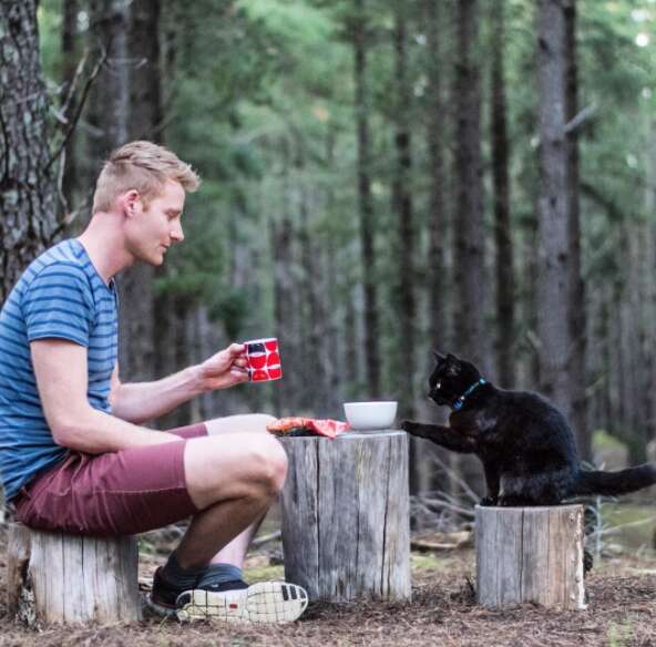 guy and cat travel together