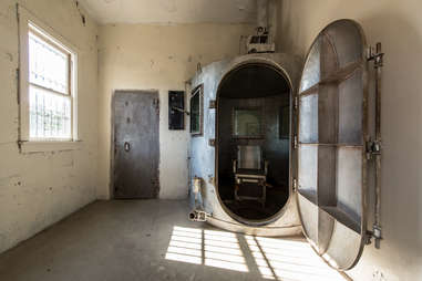 an electric chair in an old abandoned prison