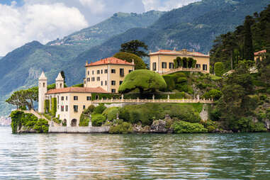 a villa by Lake Como surrounded by greenery