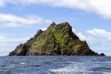 a large mountain island rising from the sea