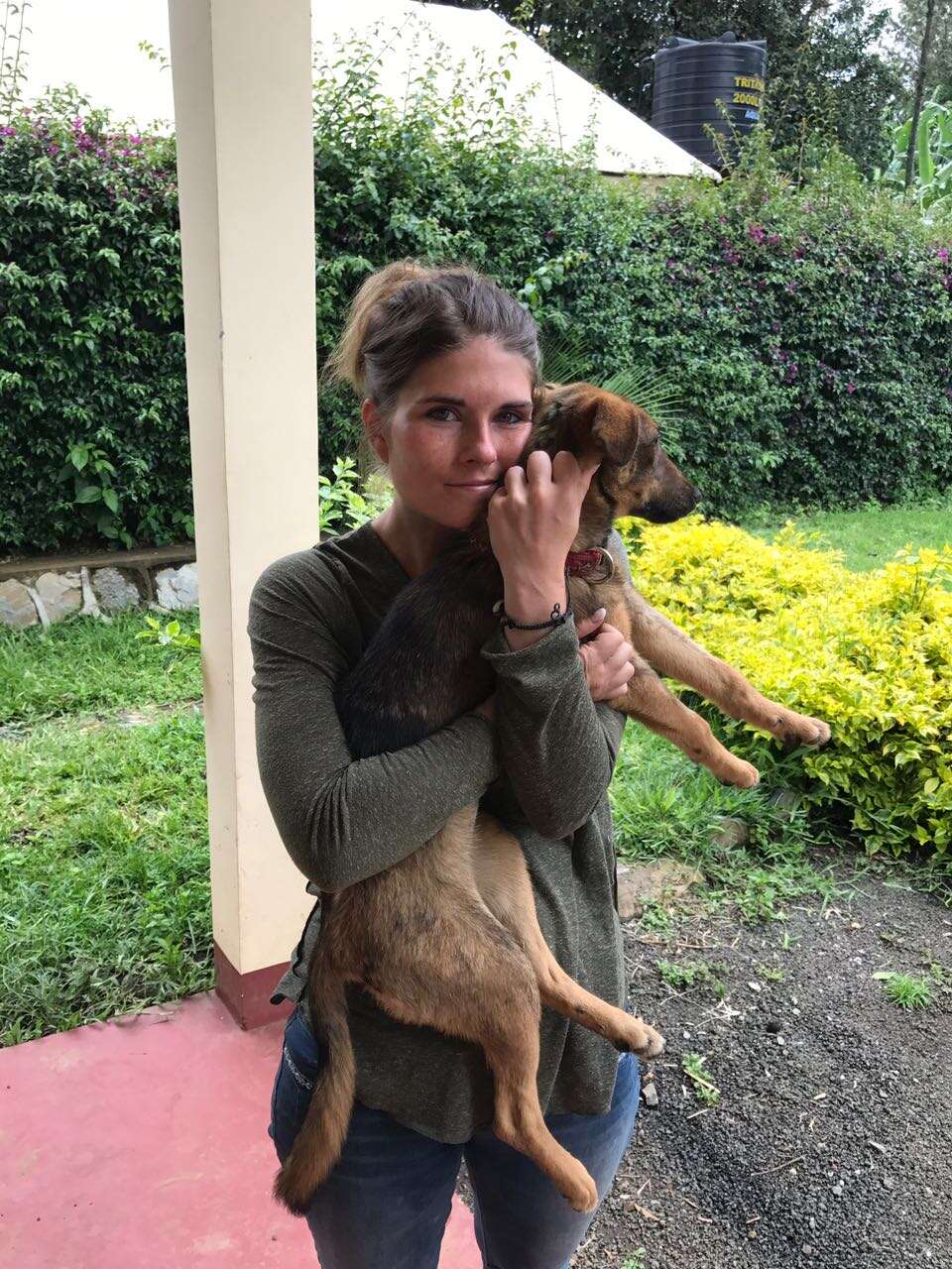 Woman holding rescued dog