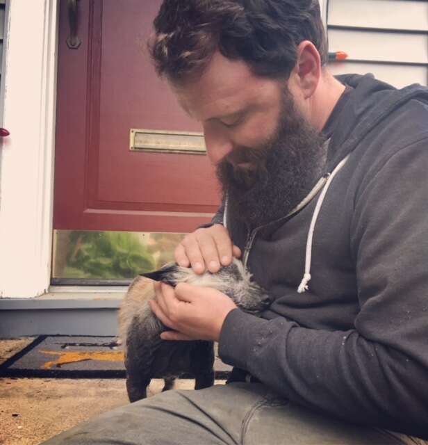 Man comforting rescue dog