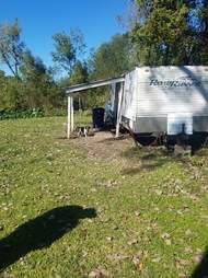 Dog chained up in front of RV home