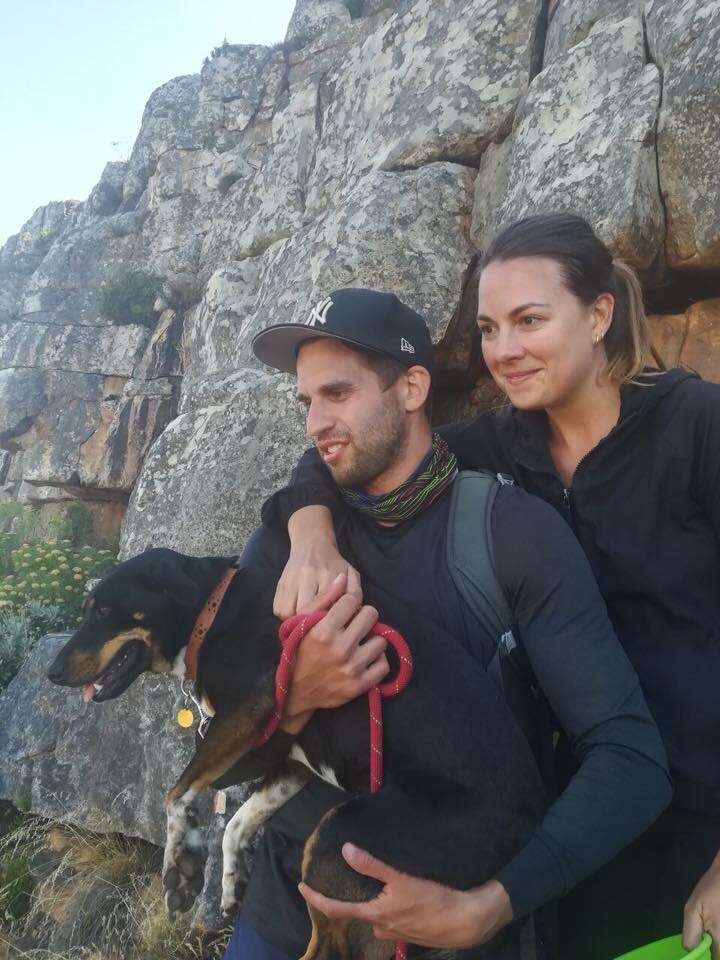 Couple holding dog