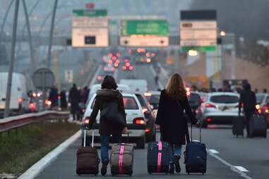 suitcases highway airport