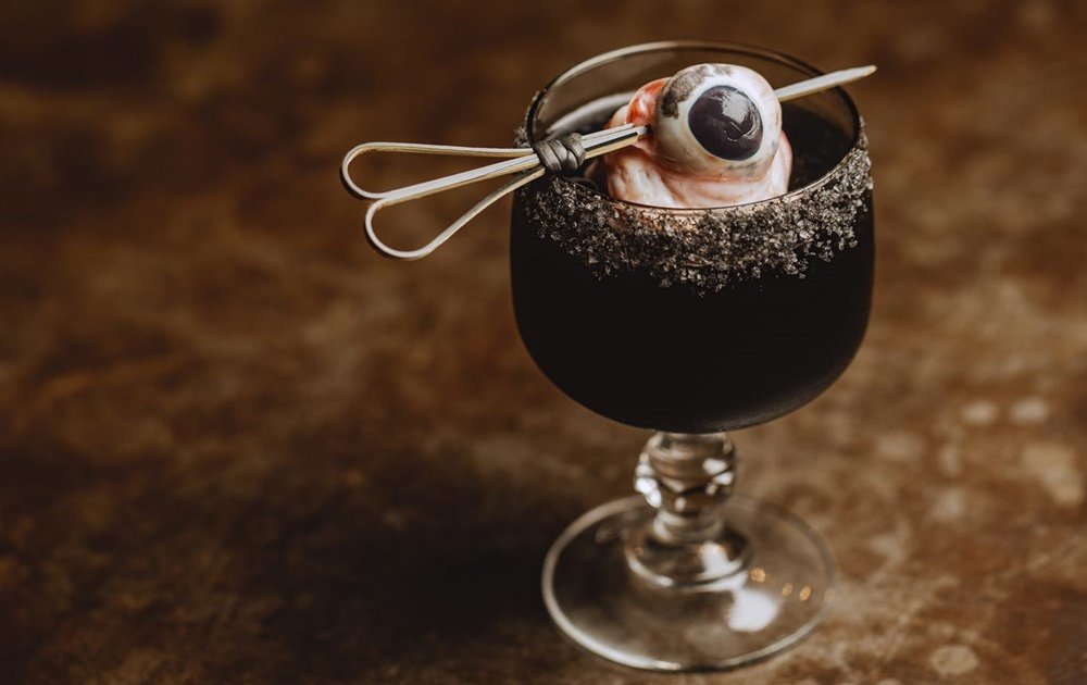 Black Margarita Served at Australian Bar Garnished With Pig Eyeballs