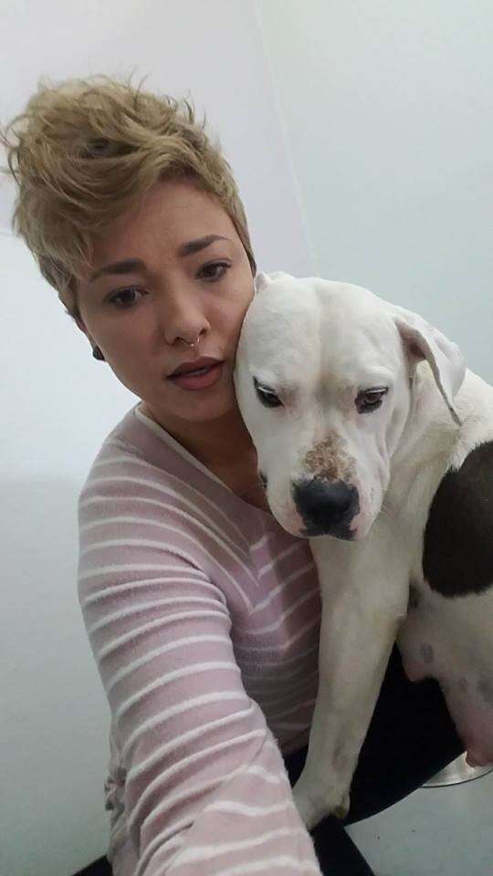 Woman hugging dog