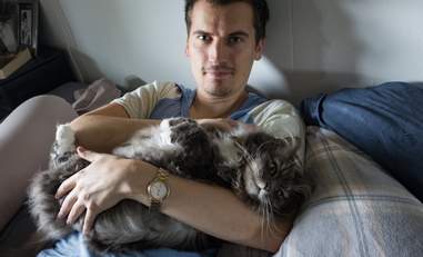 cat loves being held like a baby