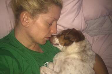 Jami snuggles her rescue dog George