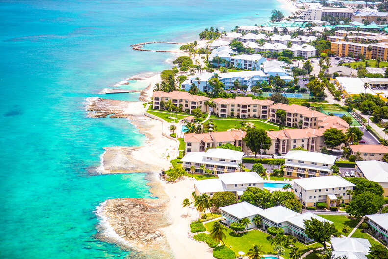 hotel resorts lining a beautiful island shore
