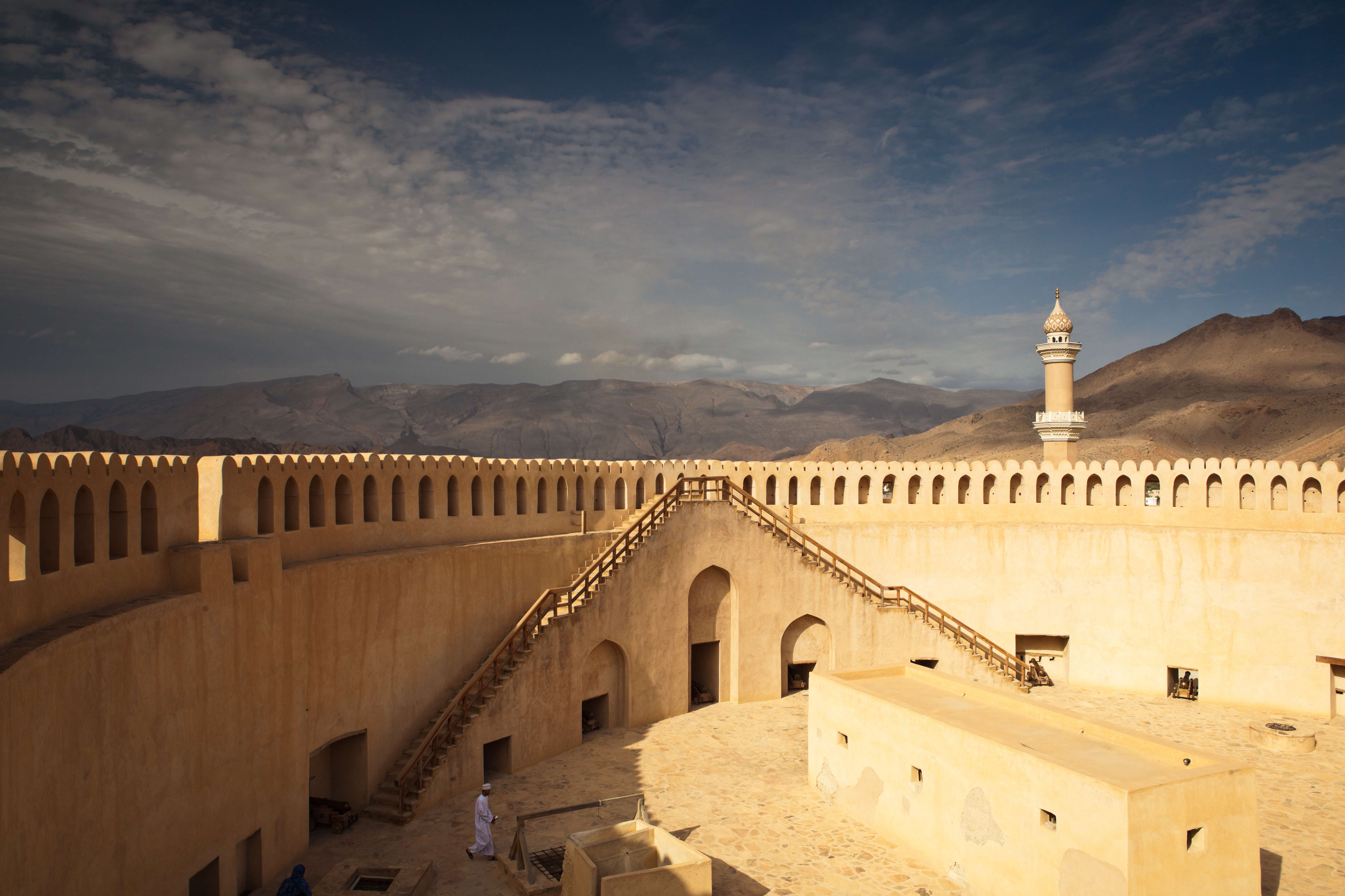 nizwa fort and mountains 