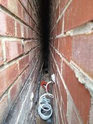 kittens trapped between two walls