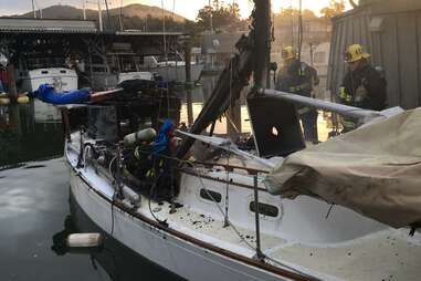 A charred sailboat in the San Rafael Yacht Harbor
