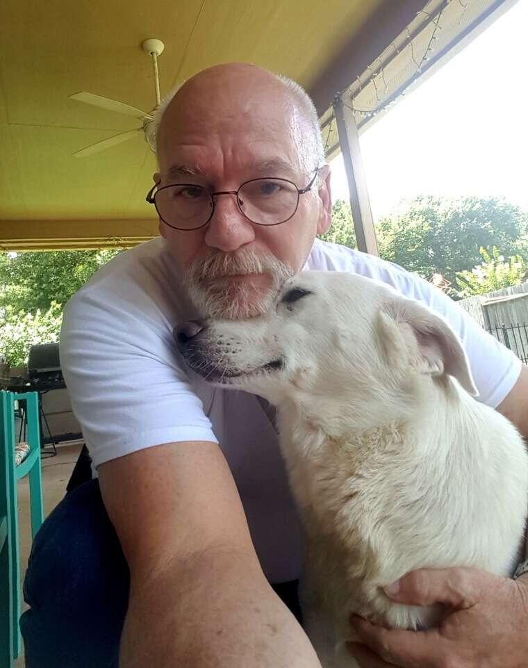 Dr. Michael White and his foster dog Janelle